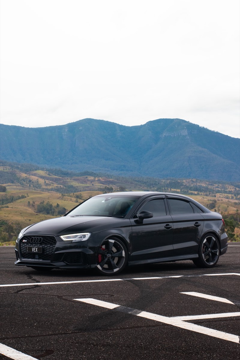 Audi RS3 photographed on a mountain helipad after a track event